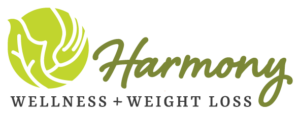 Logo for Harmony Wellness + Weight Loss, featuring a green circle with stylized leaves and the brand name in script font. - Duvall Chamber
