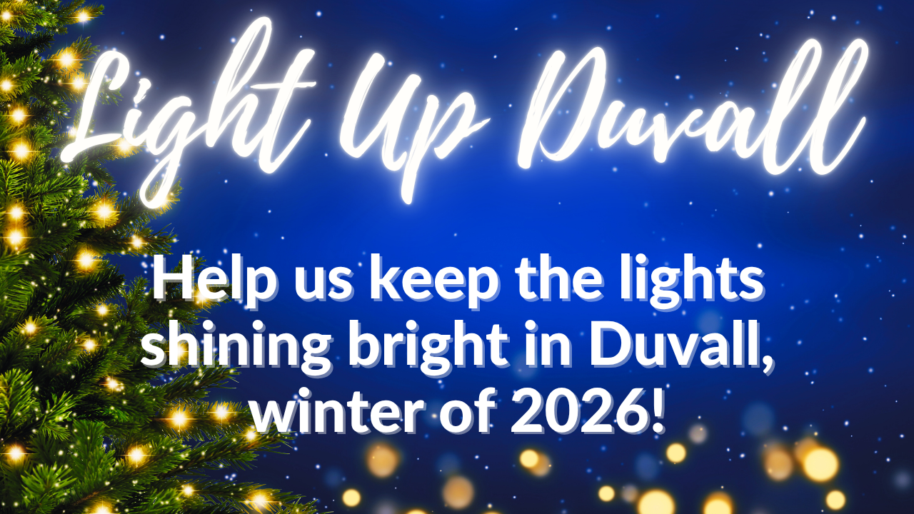 Christmas lights on a tree with the text "Light Up Duvall. Help us keep the lights shining bright in Duvall, winter of 2026!" on a blue, starry background. - Duvall Chamber